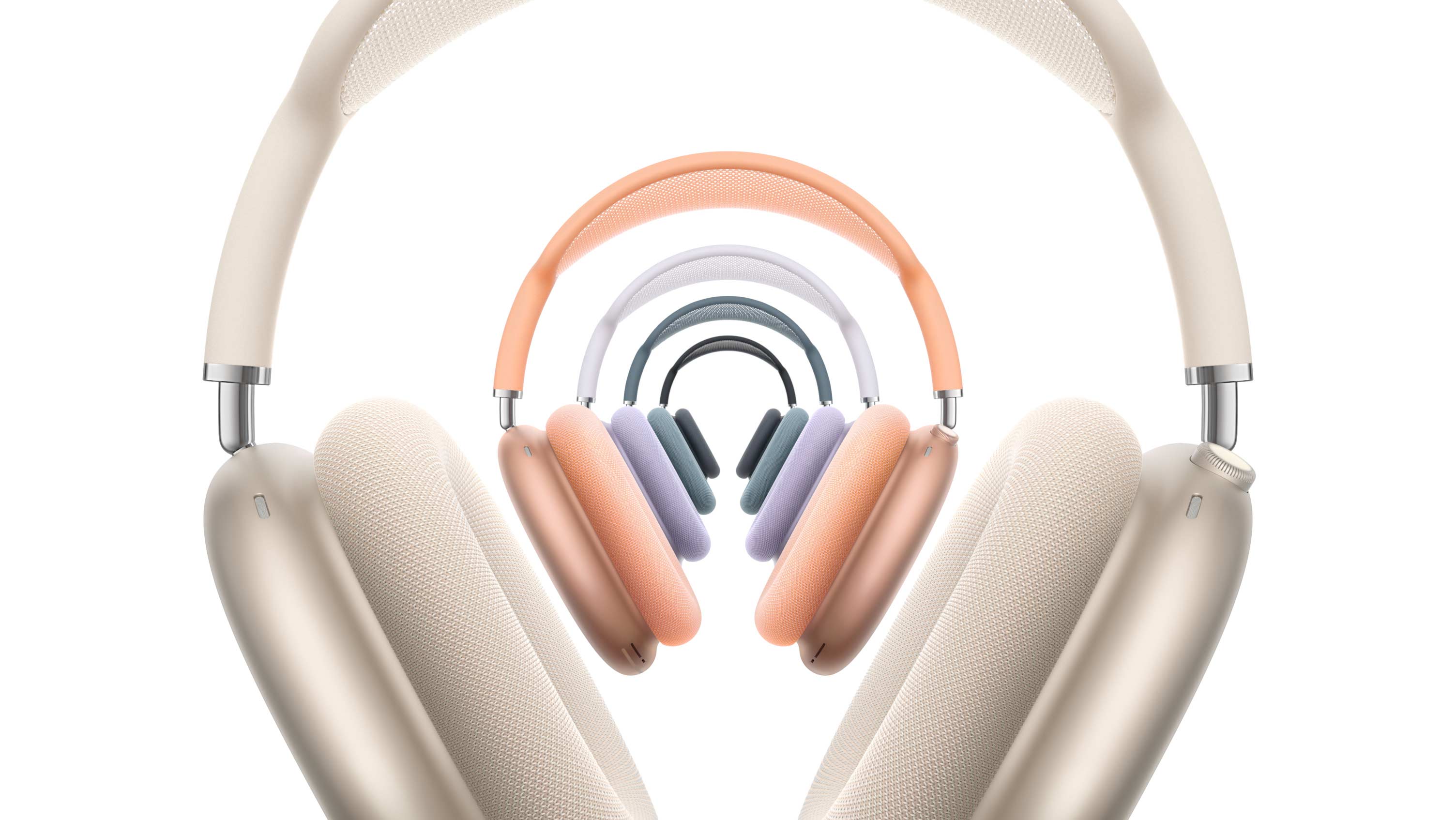 不同颜色的 AirPods Max，分别是星光色、午夜色、蓝色、紫色和橙色。